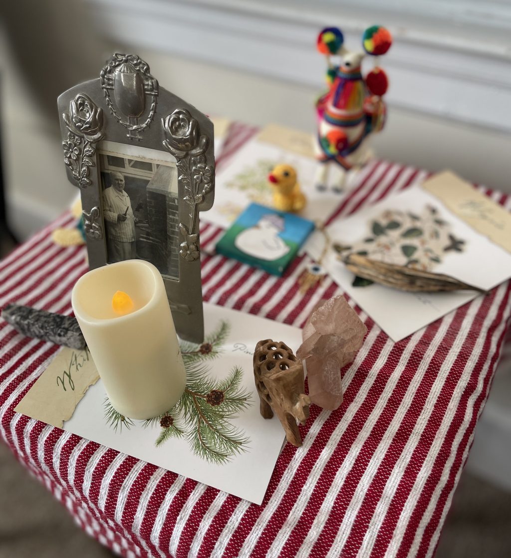 Small Altar on a red and white striped cloth